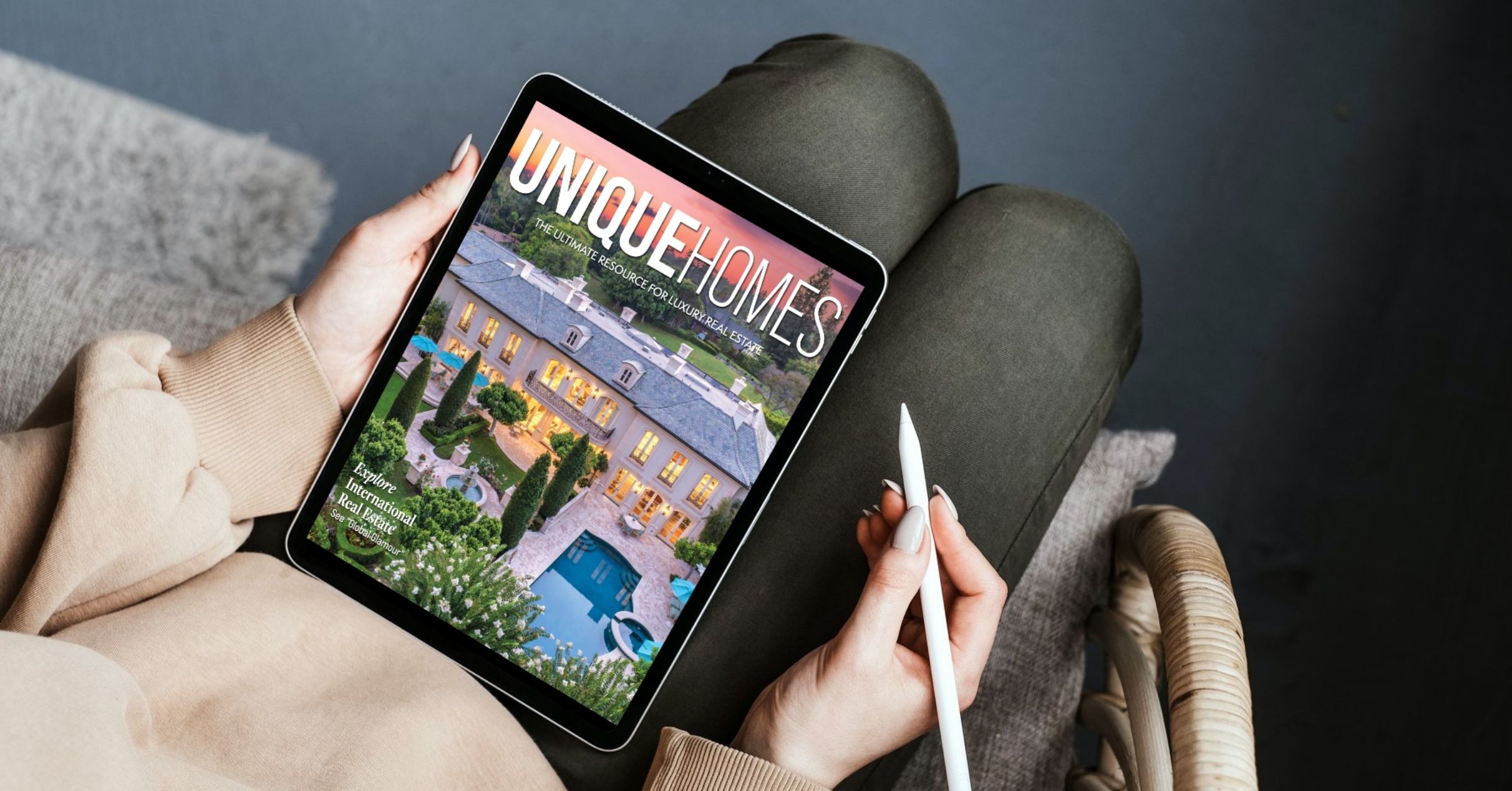 person reading unique homes magazine